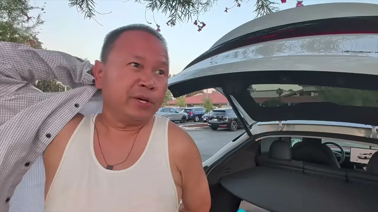 Sherwin arrived in Bakersfield with the white Model Y Juniper parked at the hotel, hatch open