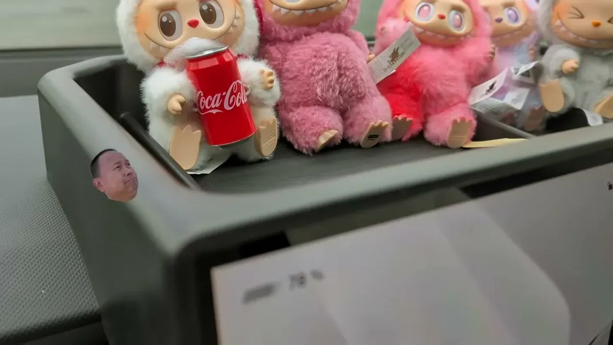 Cybertruck dash tray filled with plush toys — how Abby uses it