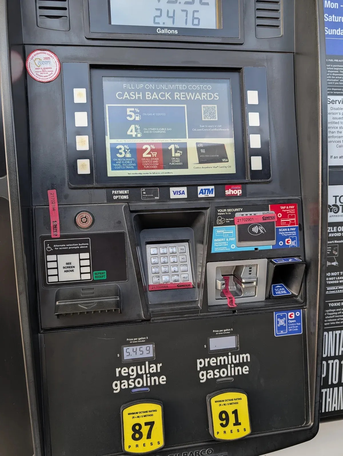 Close-up of a Costco gas pump screen showing 2.476 gallons dispensed at $5.459 per gallon