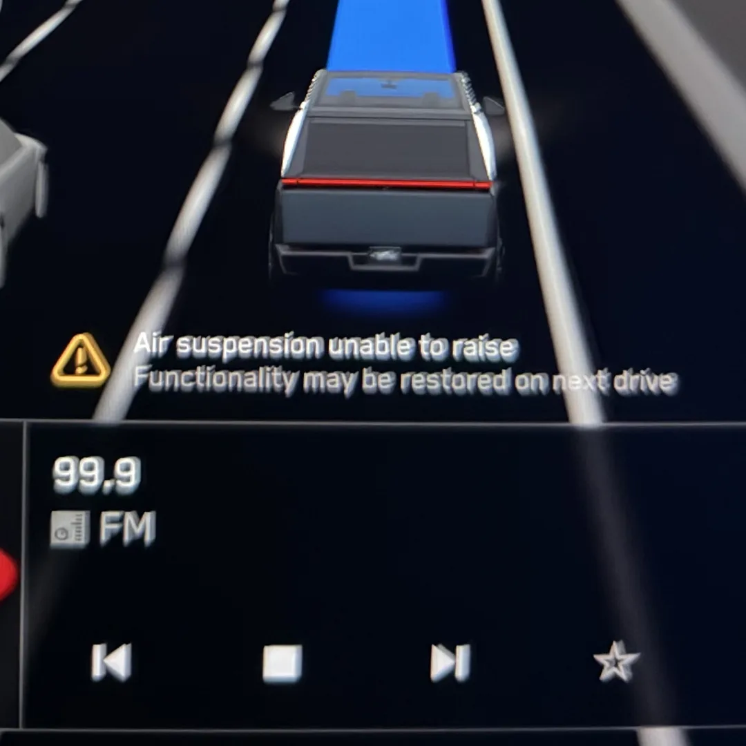 Cybertruck driving display showing the amber warning: Air suspension unable to raise, Functionality may be restored on next drive.