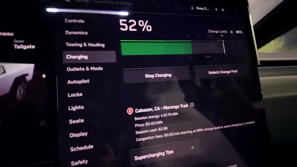Cybertruck charging screen showing 52% SOC and Supercharging details at Cabazon