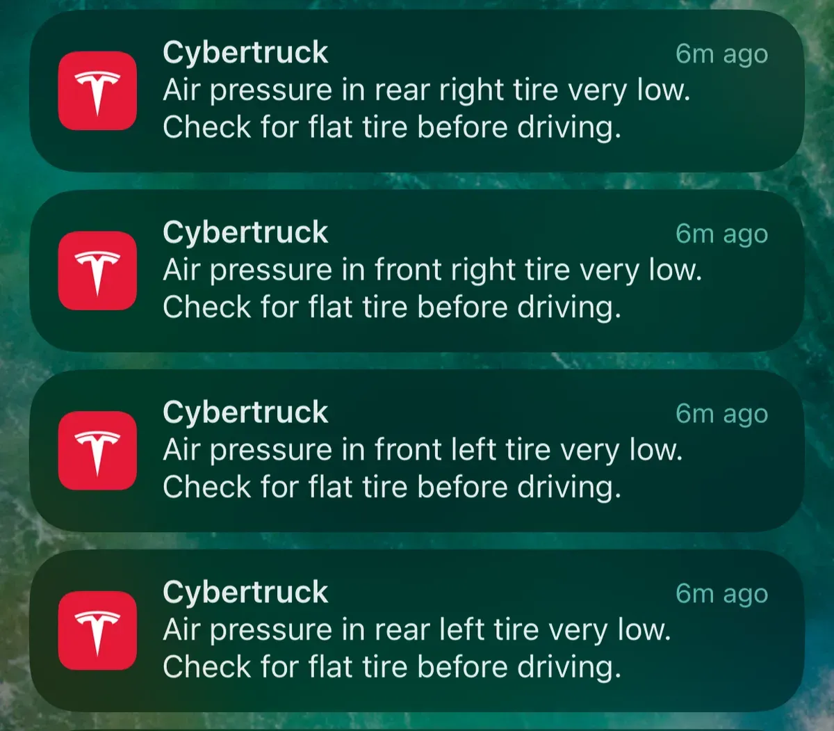 Screenshot of four Tesla Cybertruck low tire pressure warnings on a phone screen.