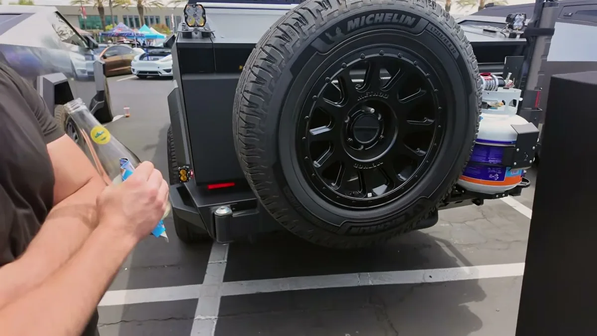 Modified Cybertruck rear with spare tire and propane tank at EV Fest