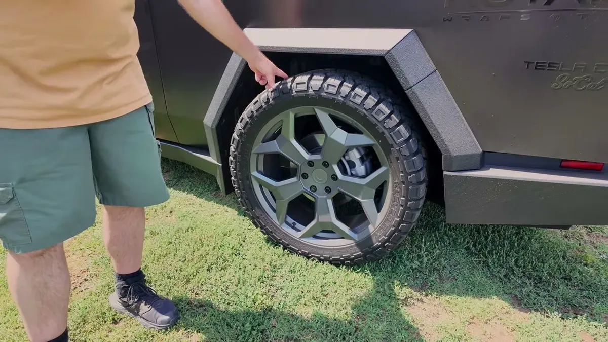 Close-up of Wil's Cybertruck off-road wheel and Kenda Cleaver tire tread, the setup that previously ran on Brian's V1
