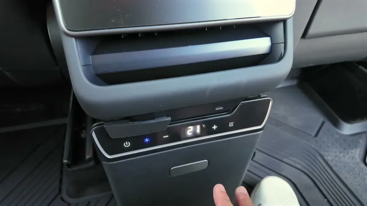 Close-up of the Teslaunch fridge control panel with digital display showing 21 and illuminated touch buttons