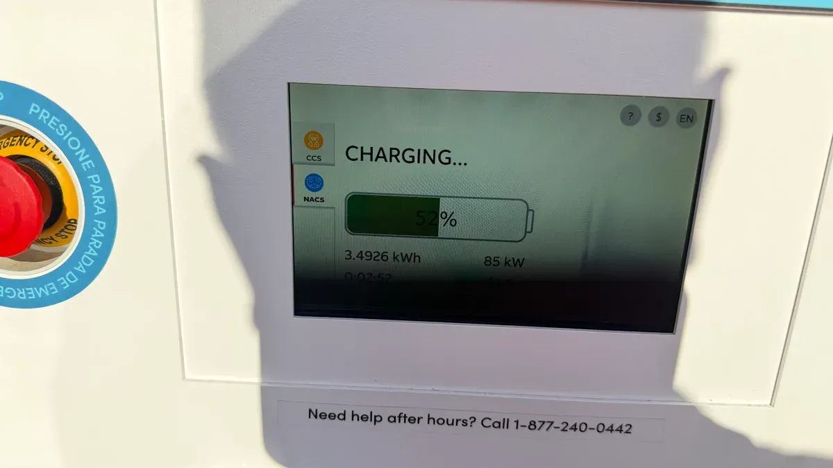 EV charging station screen at Rove showing 52% charge, 3.49 kWh delivered, and 85 kW charging speed.