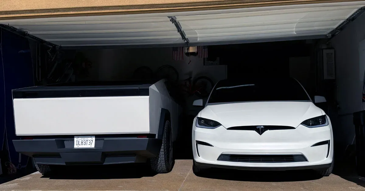 Two electric vehicles in garage