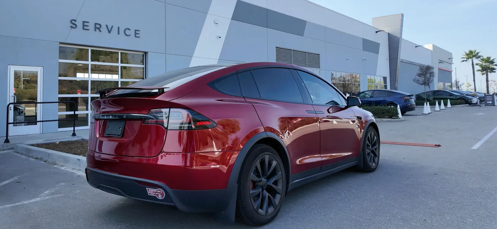 Model X Plaid in front of Tesla service