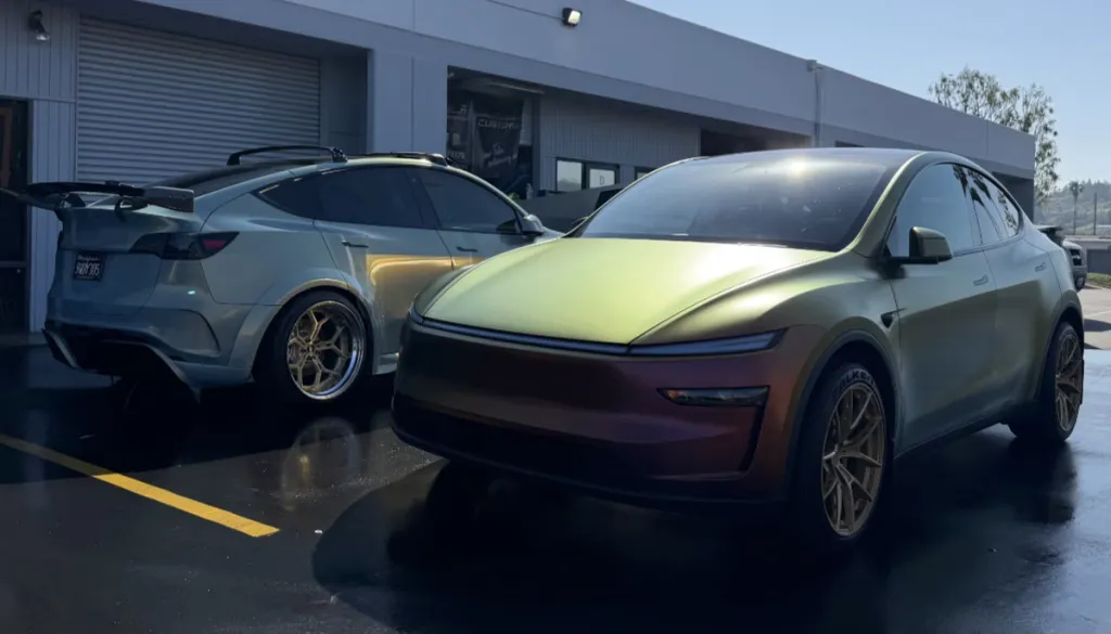 Wrapped Model Y and Juniper side by side