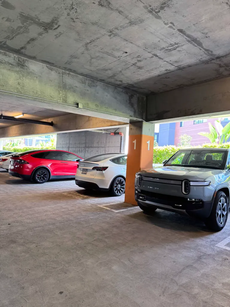 R1T hotel parking lot with other EV