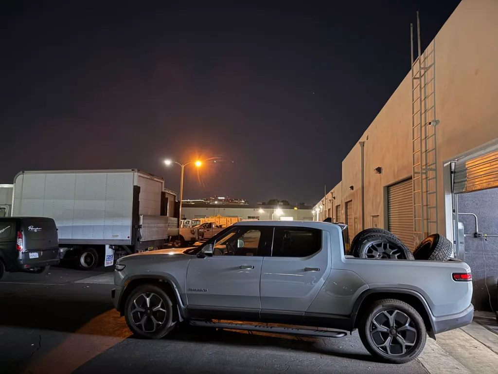 Rivian R1T hauling Cybertruck wheels and tires