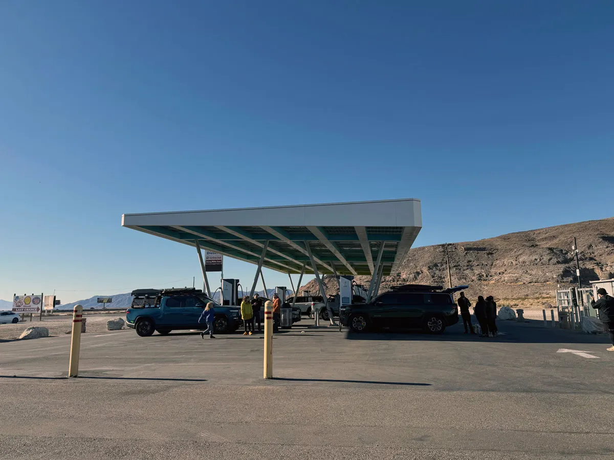 Electrify America charging station with Rivian vehicles