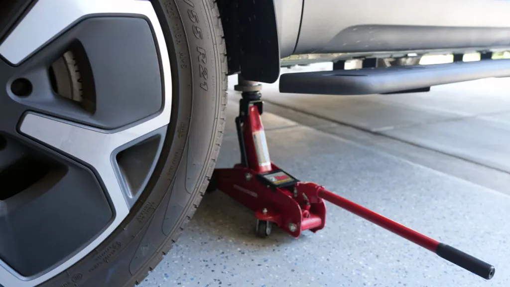 Rivian R1T with EVBase running boards and jack compatible