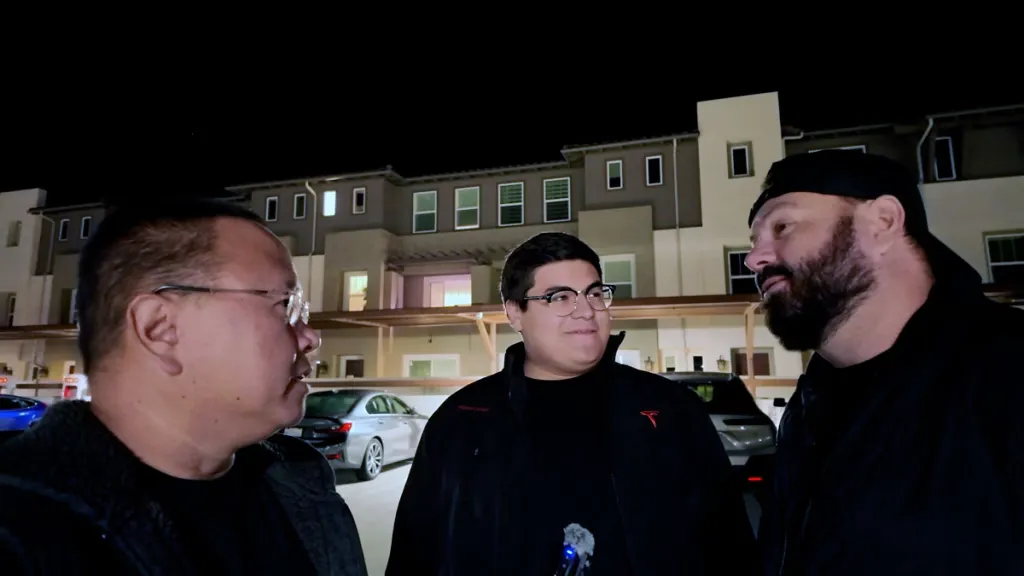 three guys talking around superchargers