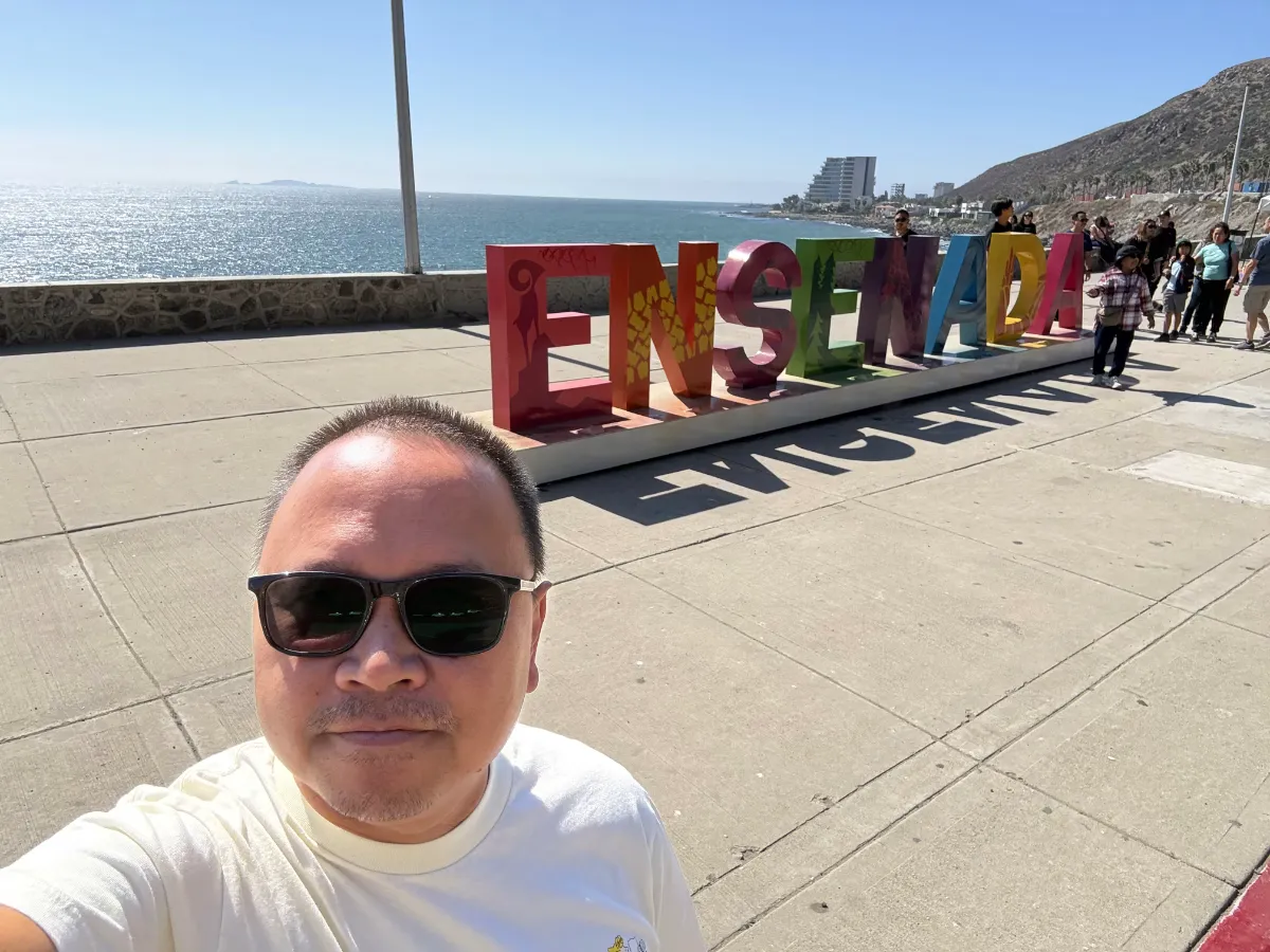 Photo in front of Ensenada sign