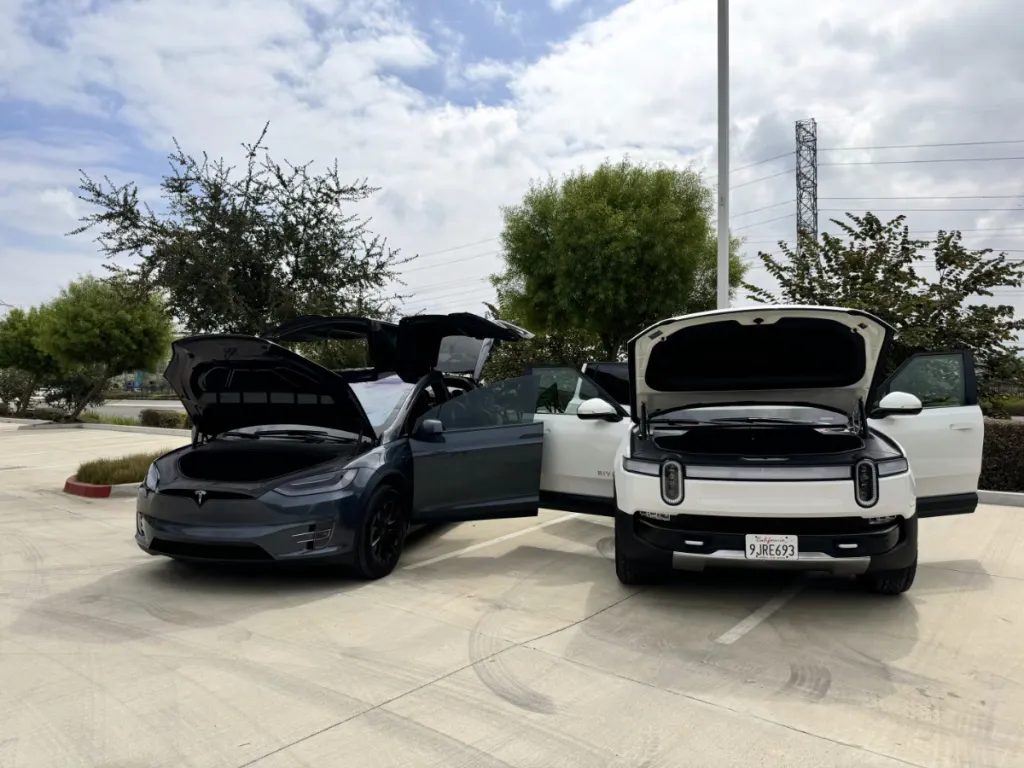 Model X next to Rivian R1S