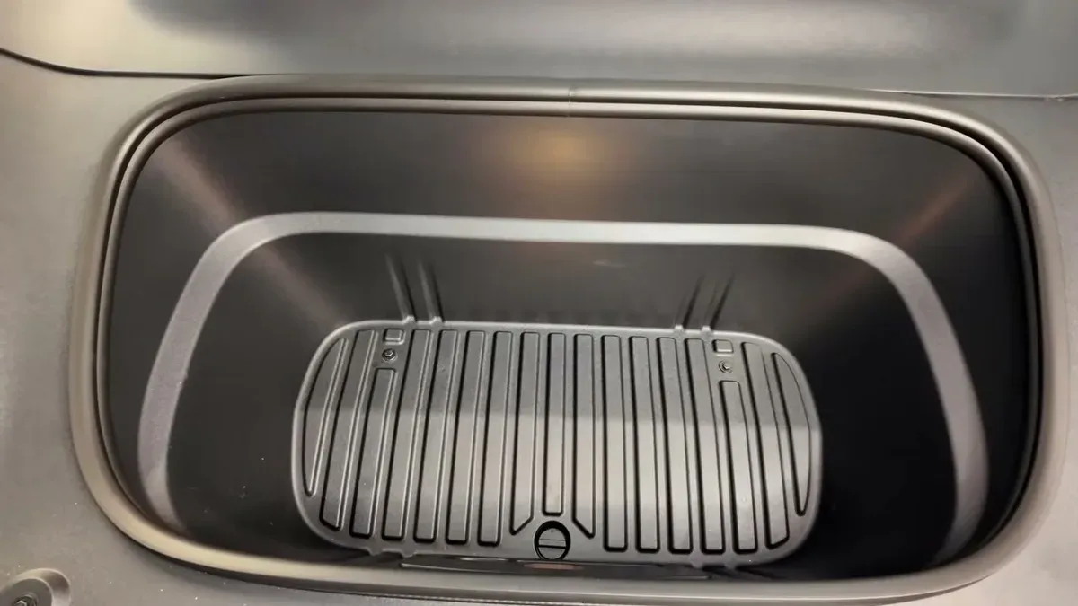 Top-down view of Jowua frunk liner installed in Tesla Model Y with drain cutout visible.