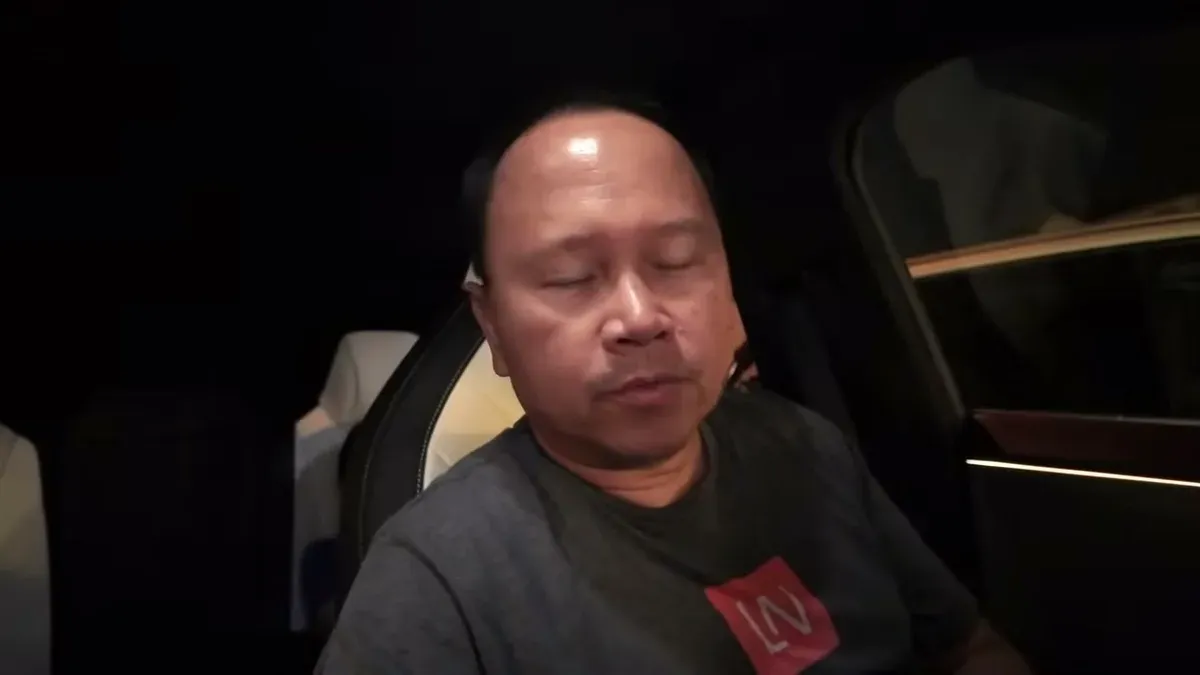 Man in car looking tired after the Joshua Tree night trip