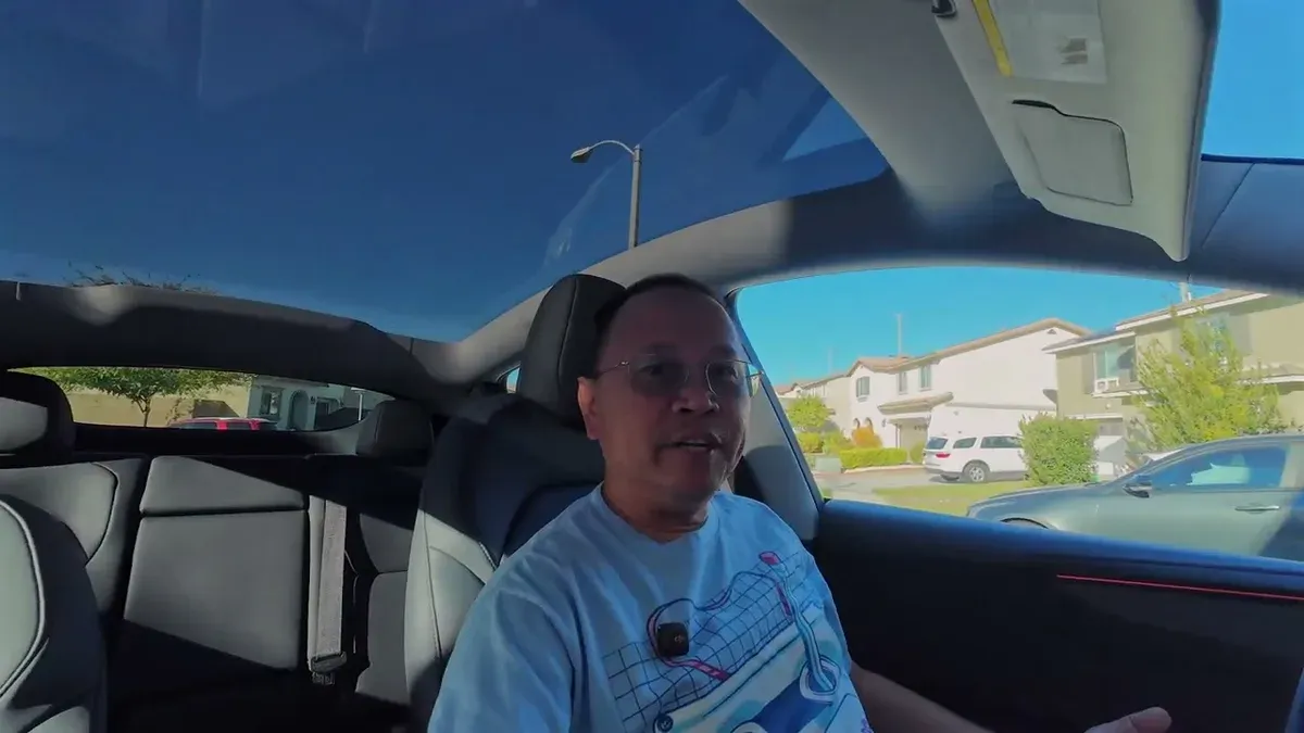 Man discussing the Acceleration Boost feature while parked in a residential neighborhood