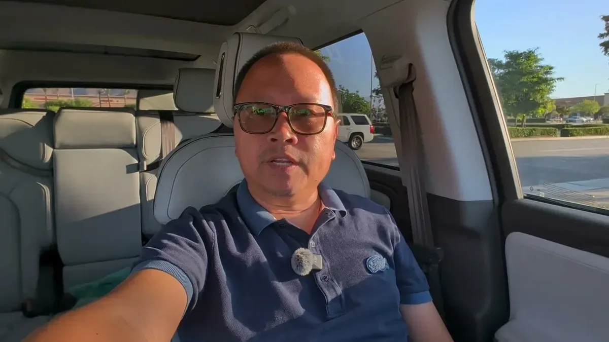 Sherwin in the driver's seat of his Rivian R1S Gen 2 before heading to the service center