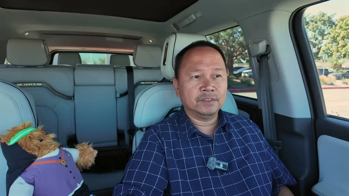 Sherwin in his Gen 2 R1S with Gear Guard Gary vampire teddy bear in the rear seat