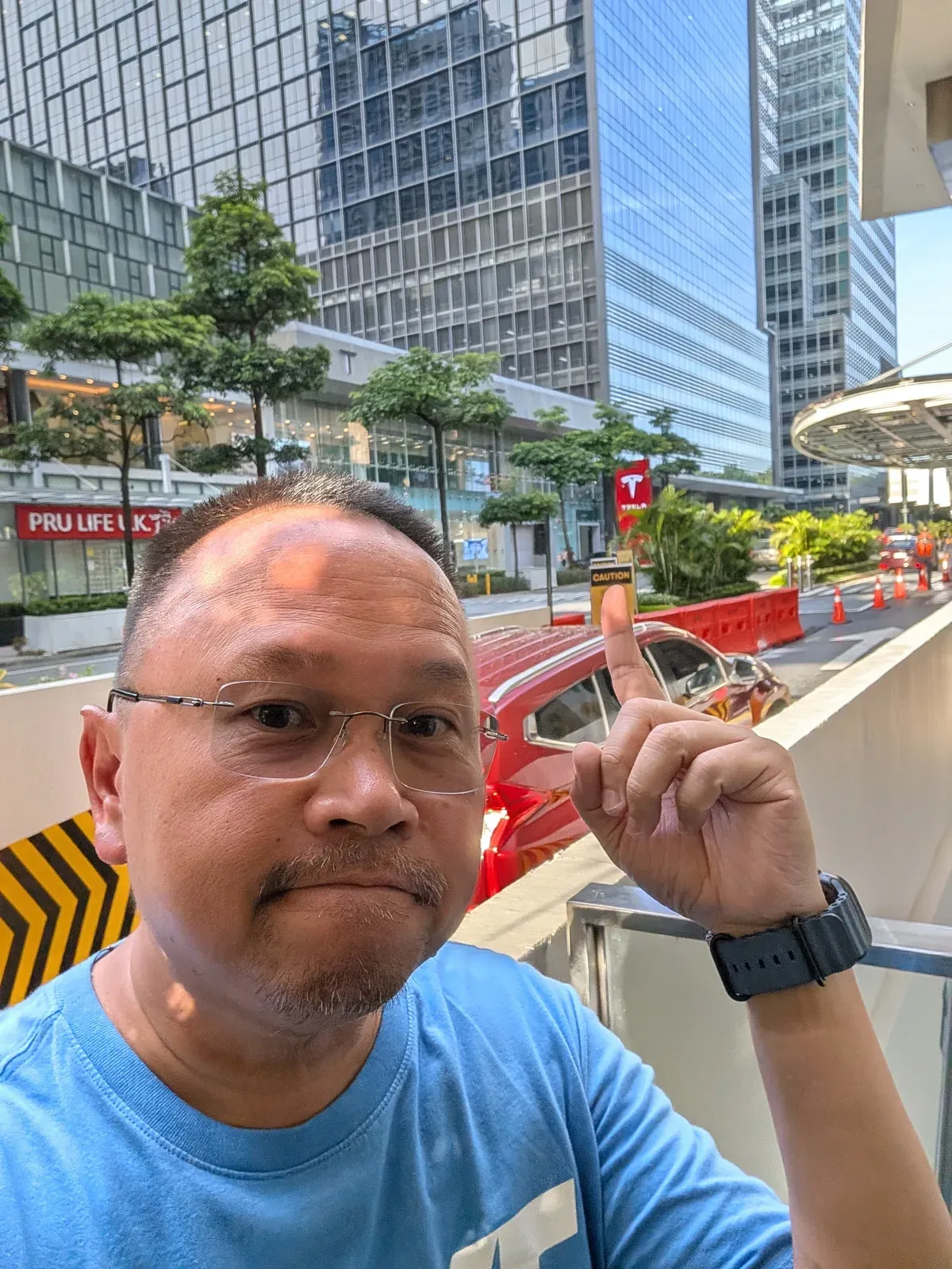 Sherwin outside the Tesla BGC showroom in the Philippines