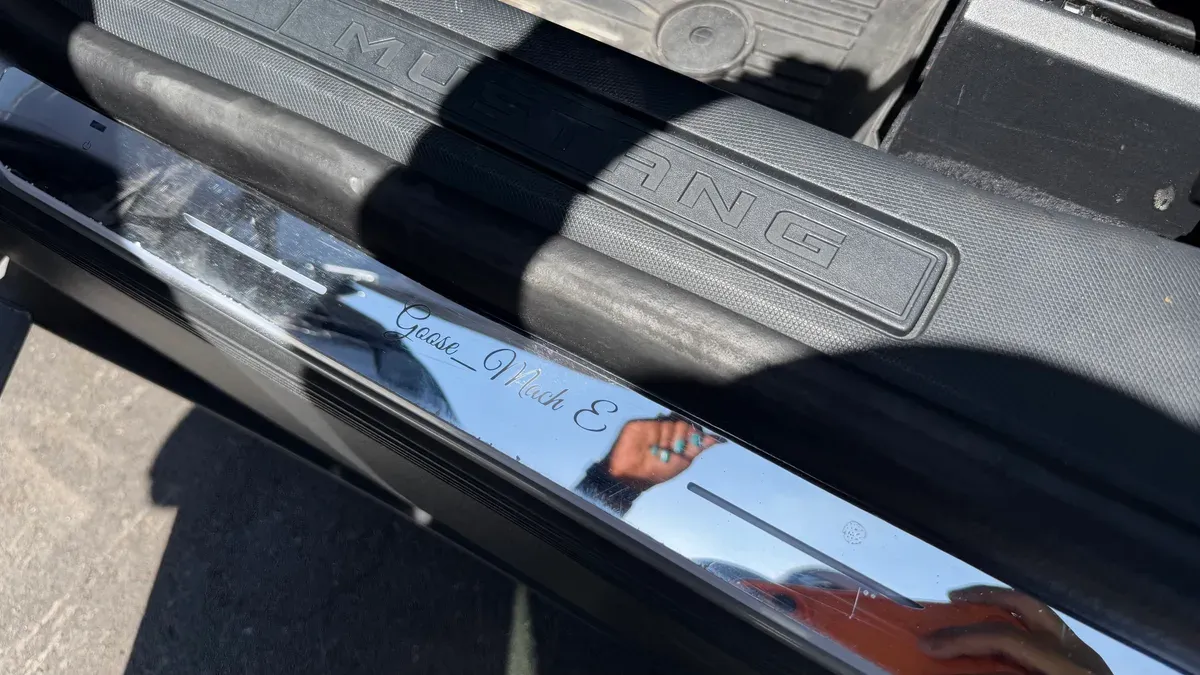 Custom chrome door sill plate with Goose_Mach E engraving on a Ford Mustang Mach-E