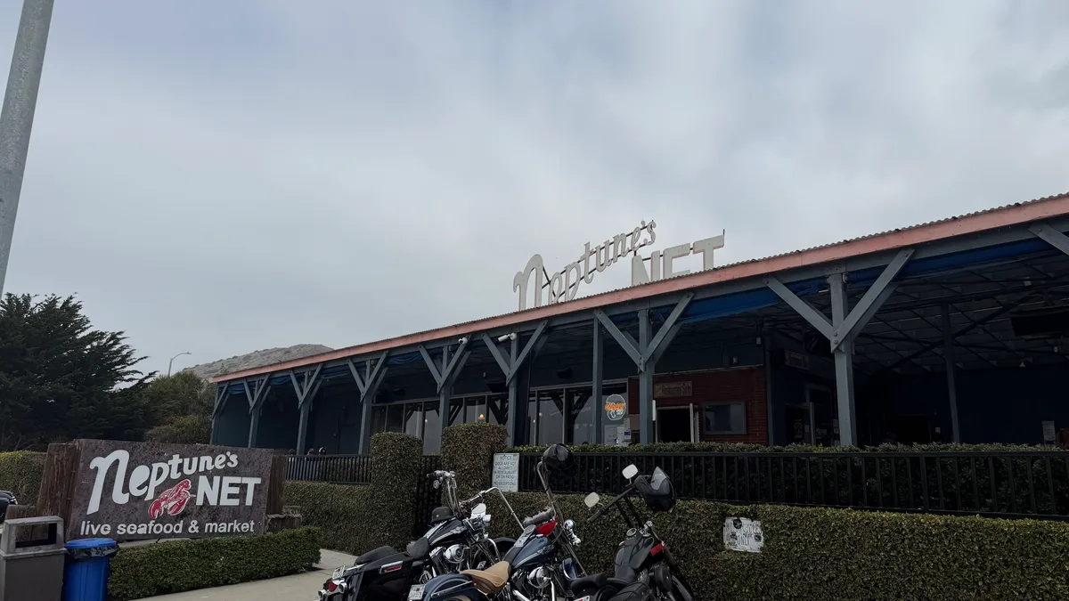 The exterior of Neptune's Net restaurant on PCH with motorcycles parked out front