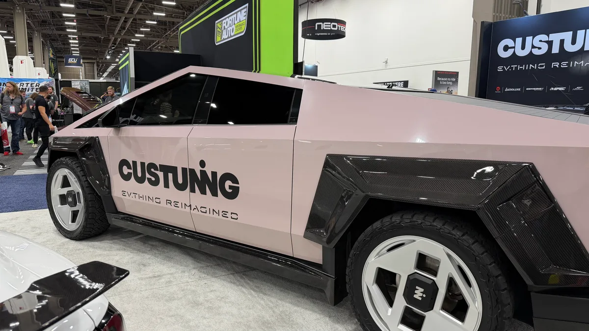 Pink Tesla Cybertruck with Custuning body kit and Inozetek wrap on display at SEMA 2025
