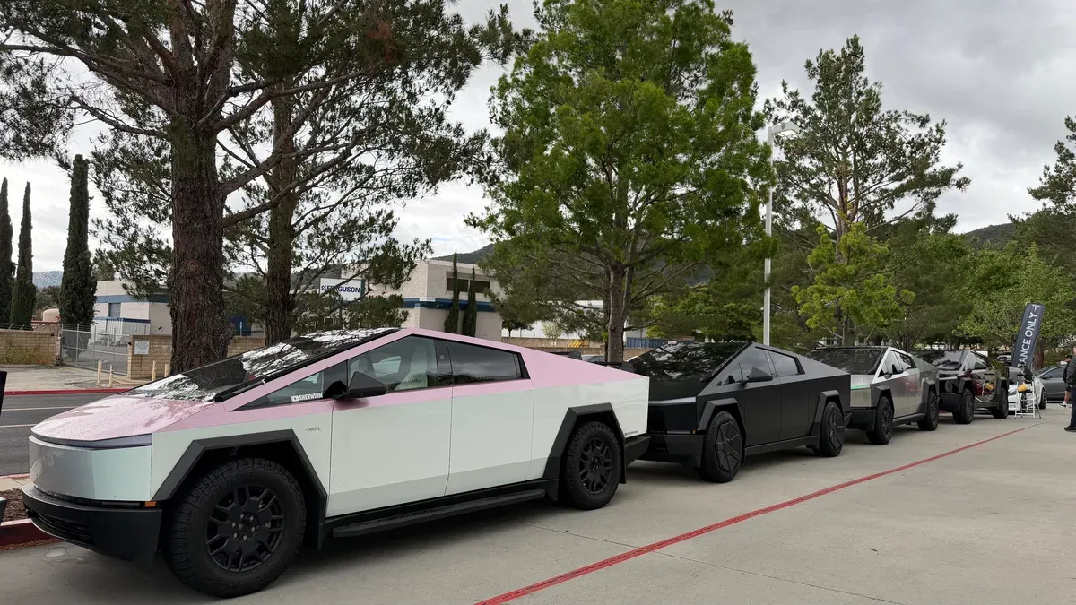 Pink and white wrapped Cybertruck in the lineup at the Temecula meet.