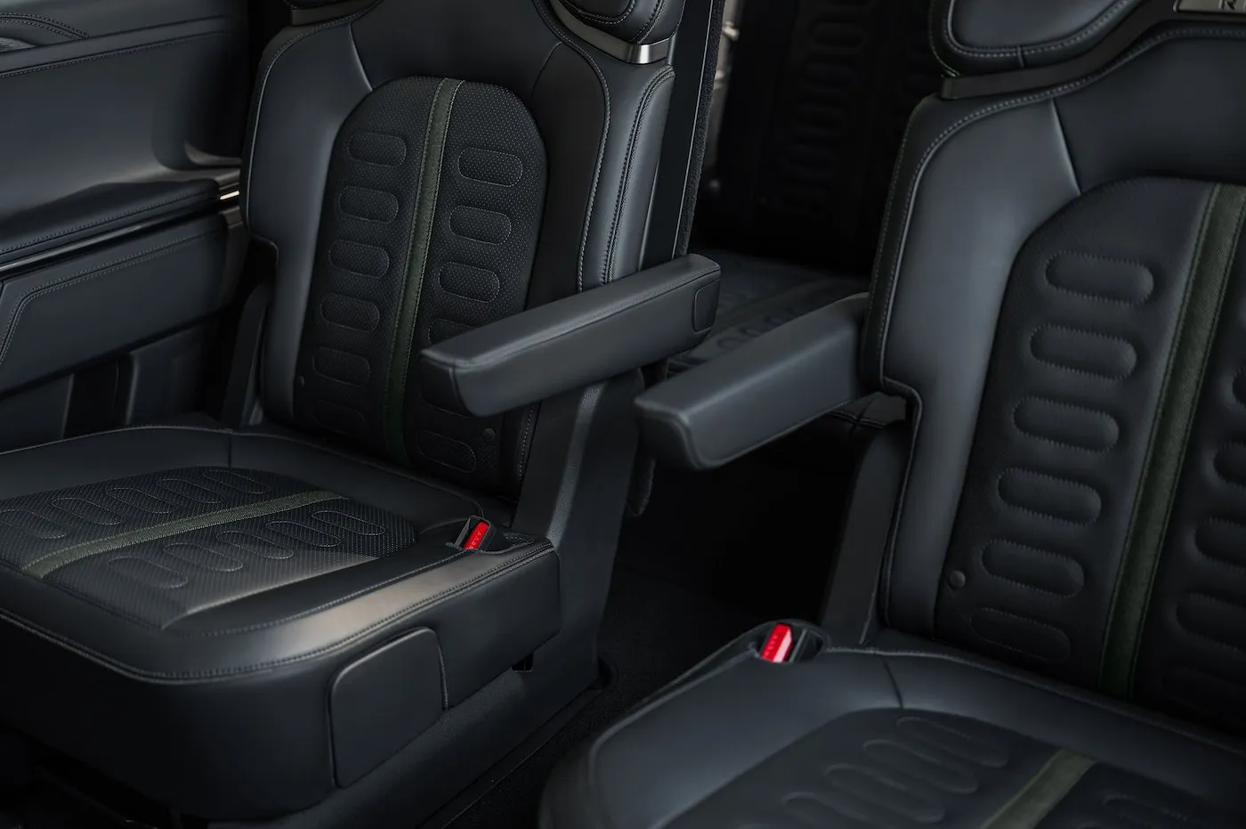 Detail shot of the new Rivian R1S second-row captain's chairs with the armrests deployed