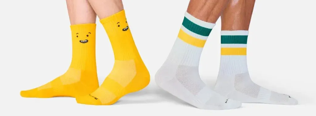 Rivian Gear Guard Gary yellow socks and striped crew socks from the Rivian Gear Shop