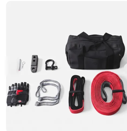 Rivian Off-Road Recovery Kit contents: duffel bag, gloves, hitch link, shackles, and tow straps