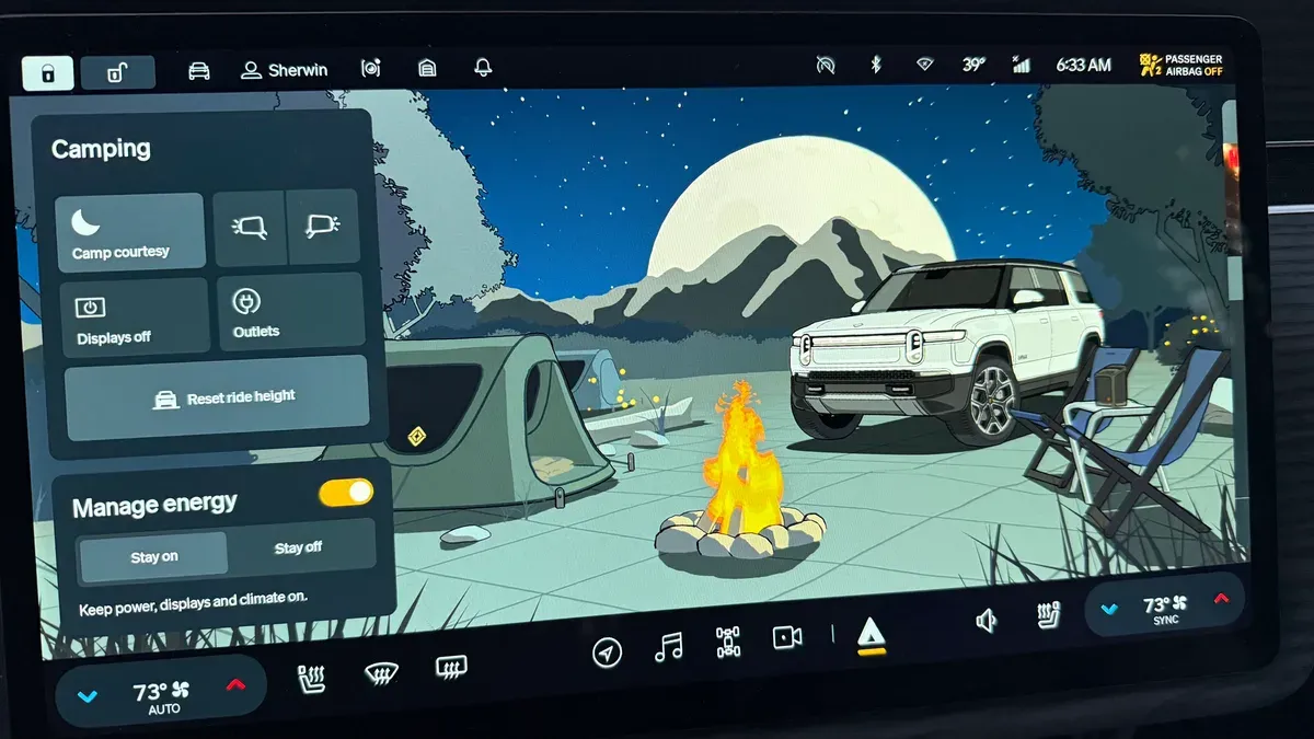 Rivian R1S infotainment screen showing Camp Mode interface at 6:33 AM with 73 degree setting and Rivian illustration