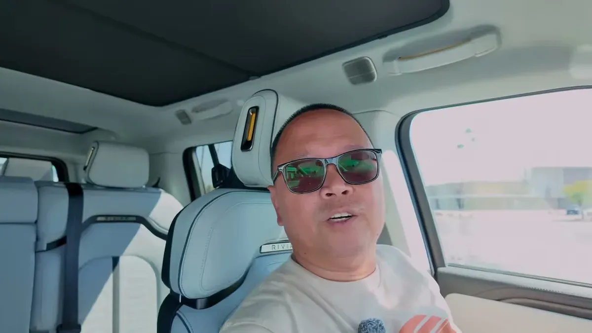 Driver in R1S discussing why he uses roof shades
