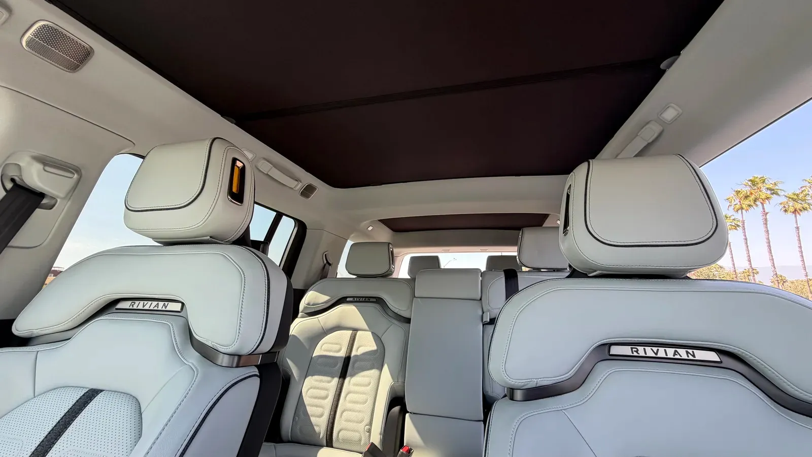 Vion third-row roof shade installed in the Rivian R1S showing a clean solid black fit