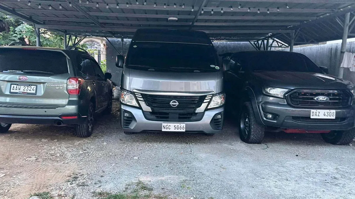 Joy's Subaru Forester XT, Nissan NV350 Urvan, and Ford Ranger parked together under a carport in the Philippines
