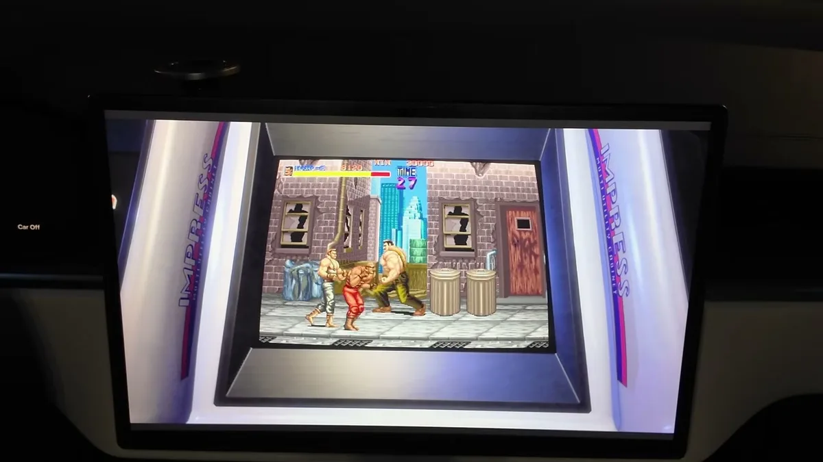 Tesla touchscreen showing Final Fight retro game from Capcom Arcade Stadium running