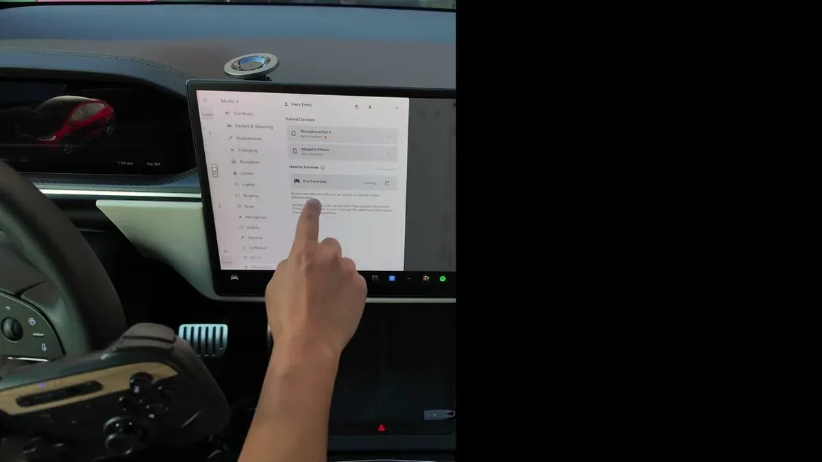 Jowua wireless controller paired via Bluetooth shown in Tesla's Bluetooth settings screen