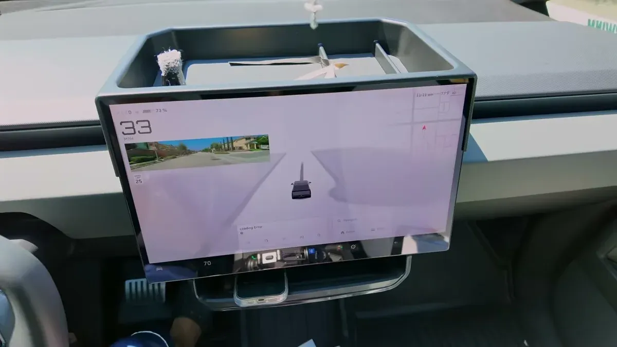Tesla Cybertruck interior showing the BestEVMod dash storage tray installed above the screen while driving