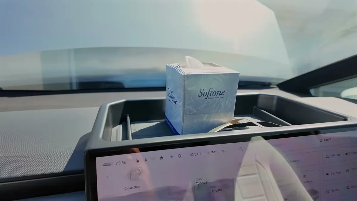 Close-up of a tissue box sitting in the BestEVMod dash tray above the Cybertruck screen
