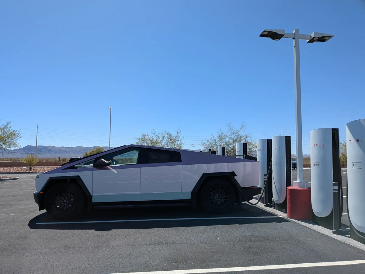 Cybertruck charging at a Tesla Supercharger in the desert