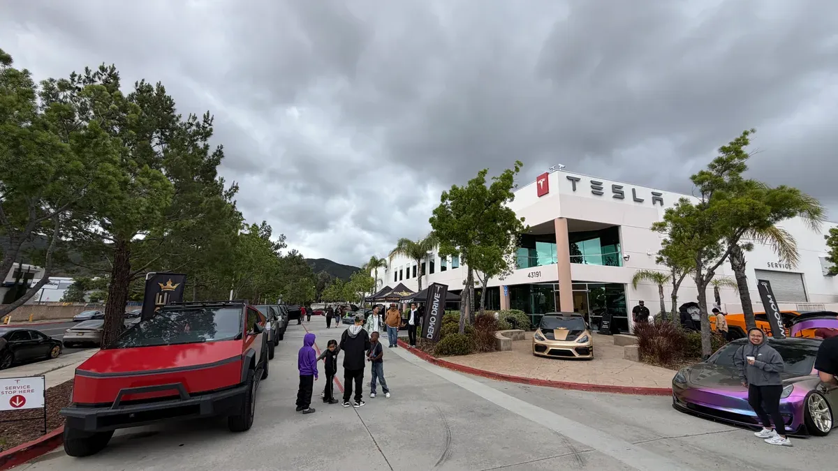 custom wrapped Cybertrucks lined up at Temecula Tesla cars and coffee event