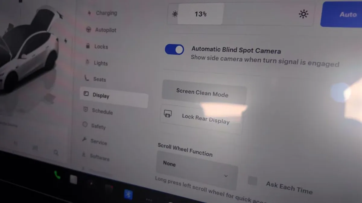 Tesla central display showing Display settings menu with Screen Clean Mode and Lock Rear Display options