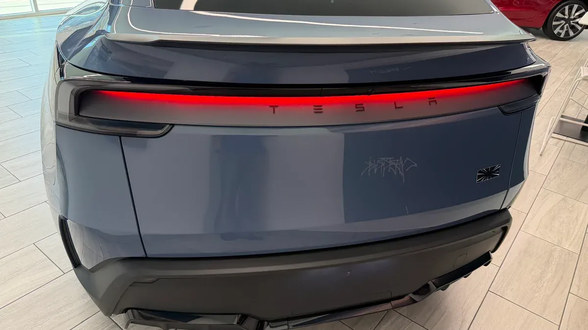 Frost Blue Metallic Model Y Performance rear LED taillight bar illuminated