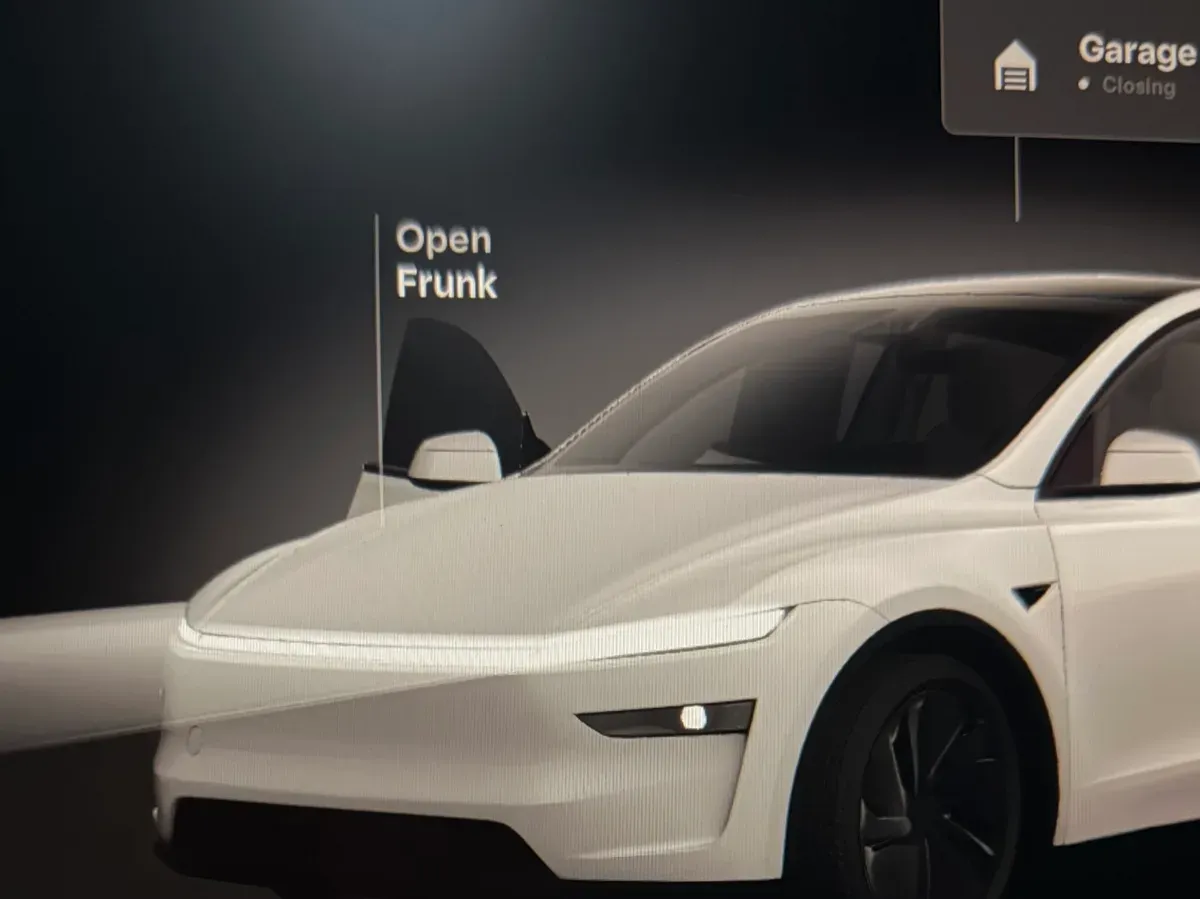 Tesla infotainment screen showing Open Frunk and Audio System Unavailable warning