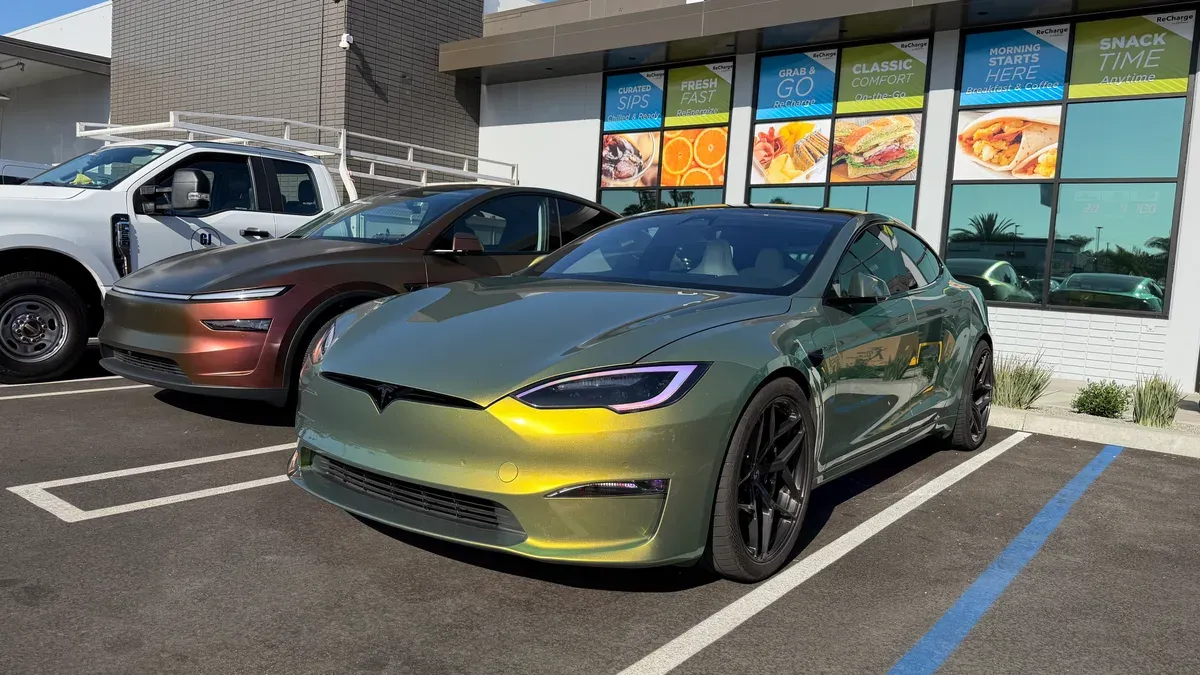 Chameleon-wrapped Tesla Model S Plaid and Lucid Air parked at Rove ReCharge Market in Costa Mesa.