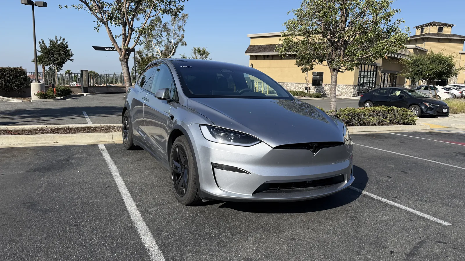 Tesla Model X front three-quarter view in a parking lot.