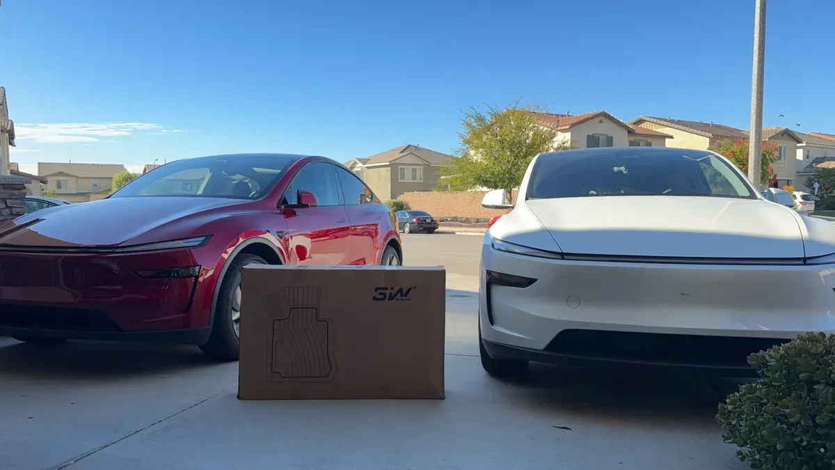 3W SW Auto-life floor mat box between a red and white Tesla Model Y in a suburban driveway