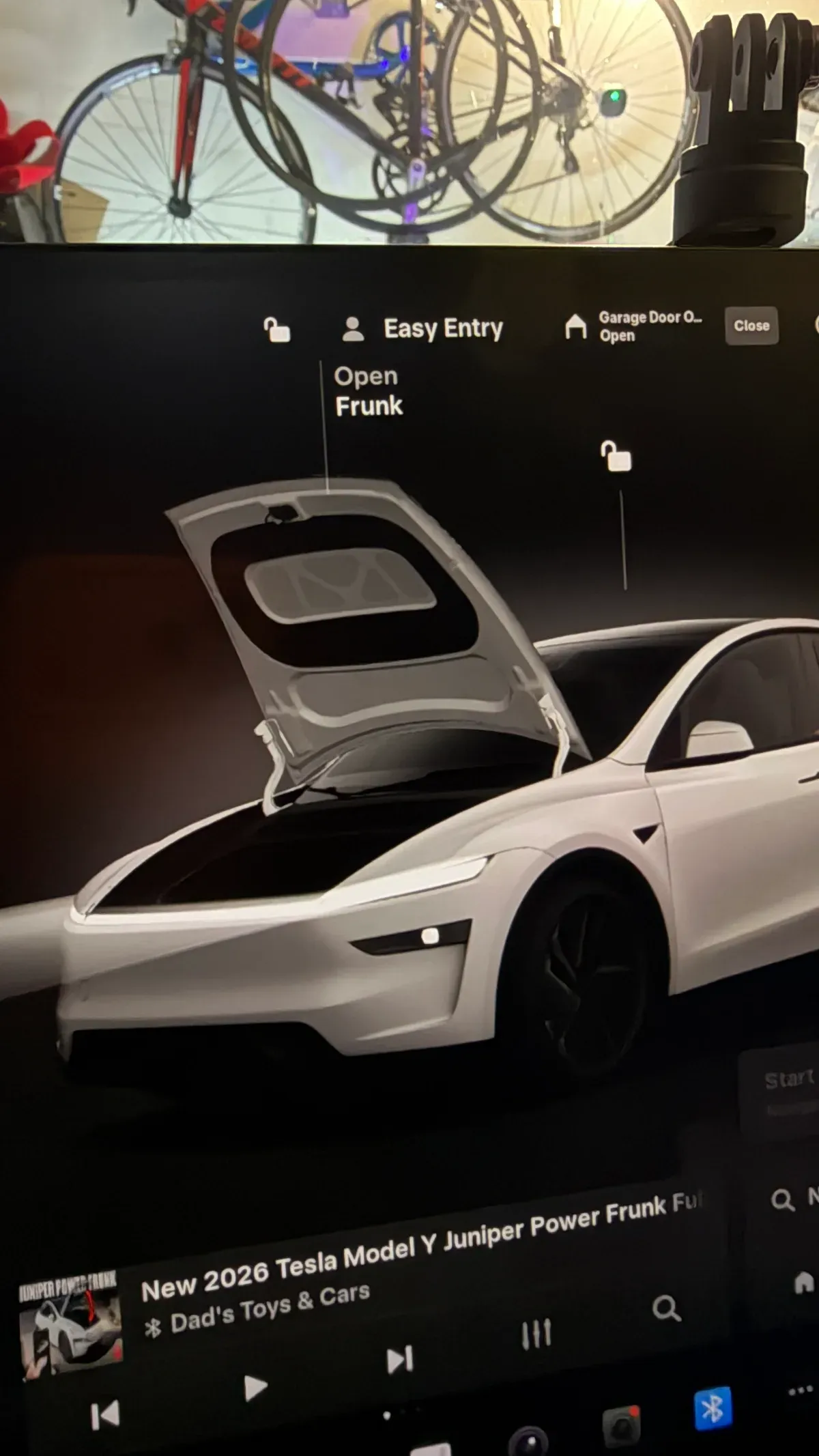 Computer screen showing Tesla Model Y Juniper with open frunk and Open Frunk UI controls